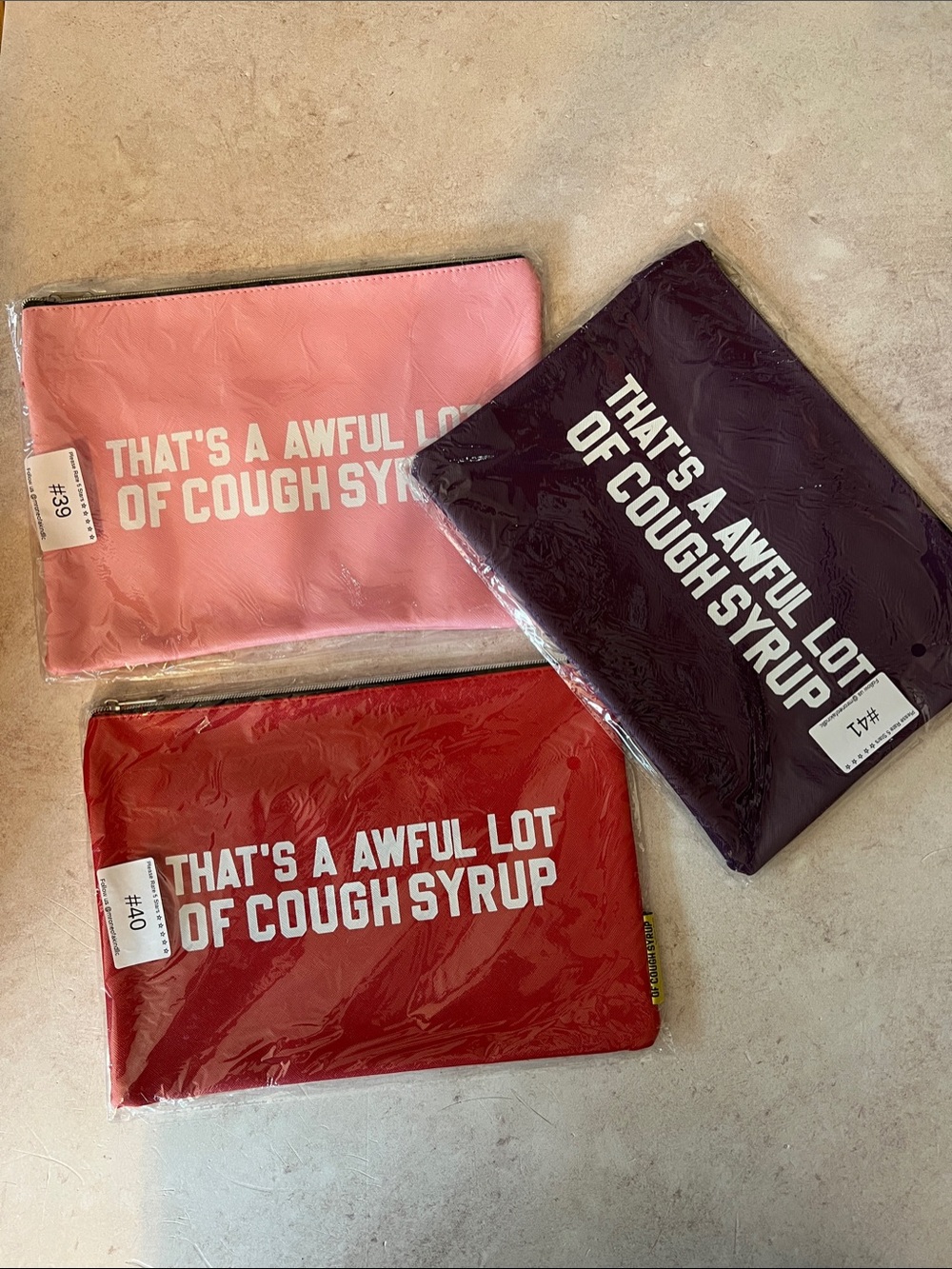 That’s A Awful Lot of Cough Syrup Money Bags. Pink, Purple or Red.
